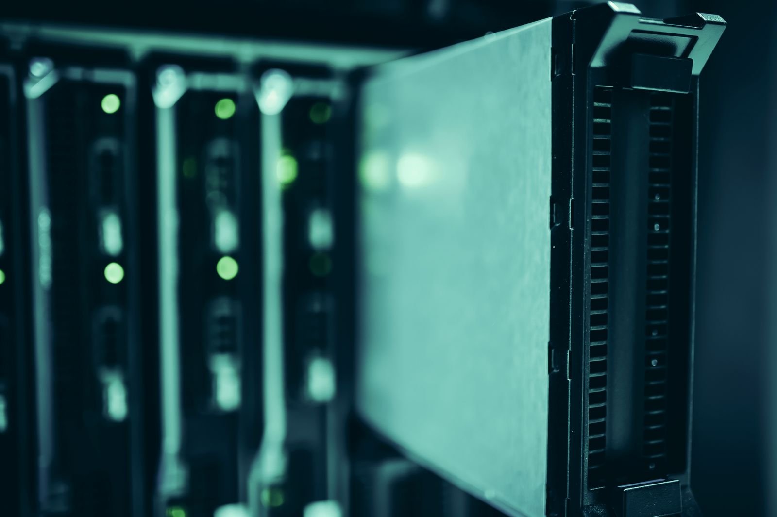 Rows of active data center server racks powering AI infrastructure