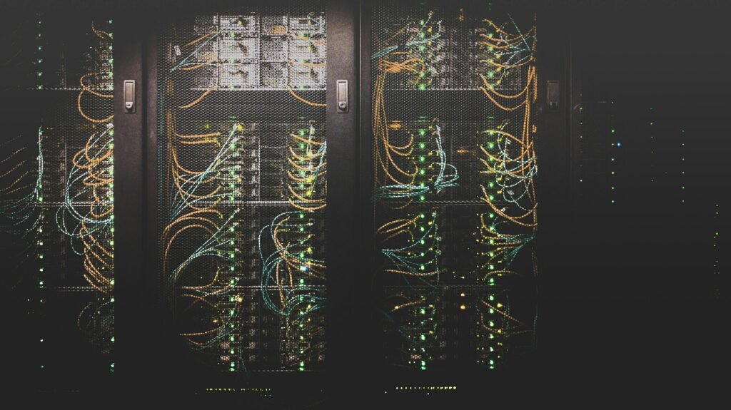 Fiber optic cables in a server rack, illustrating the interconnect technology behind co-packaged optics stocks 2026