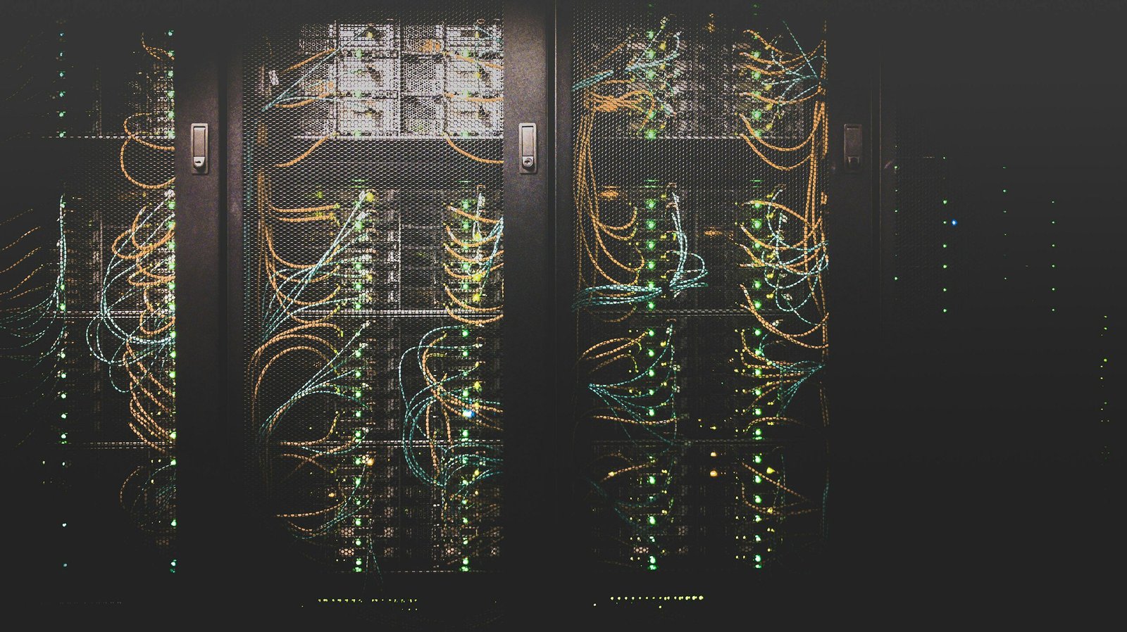 Fiber optic cables in a server rack, illustrating the interconnect technology behind co-packaged optics stocks 2026
