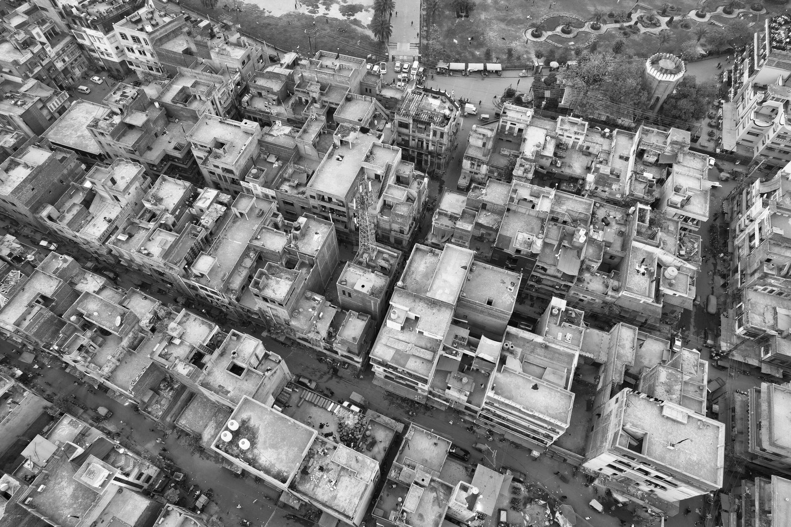 DHA Lahore commercial file rates - aerial view of dense residential rooftops in Lahore, Pakistan