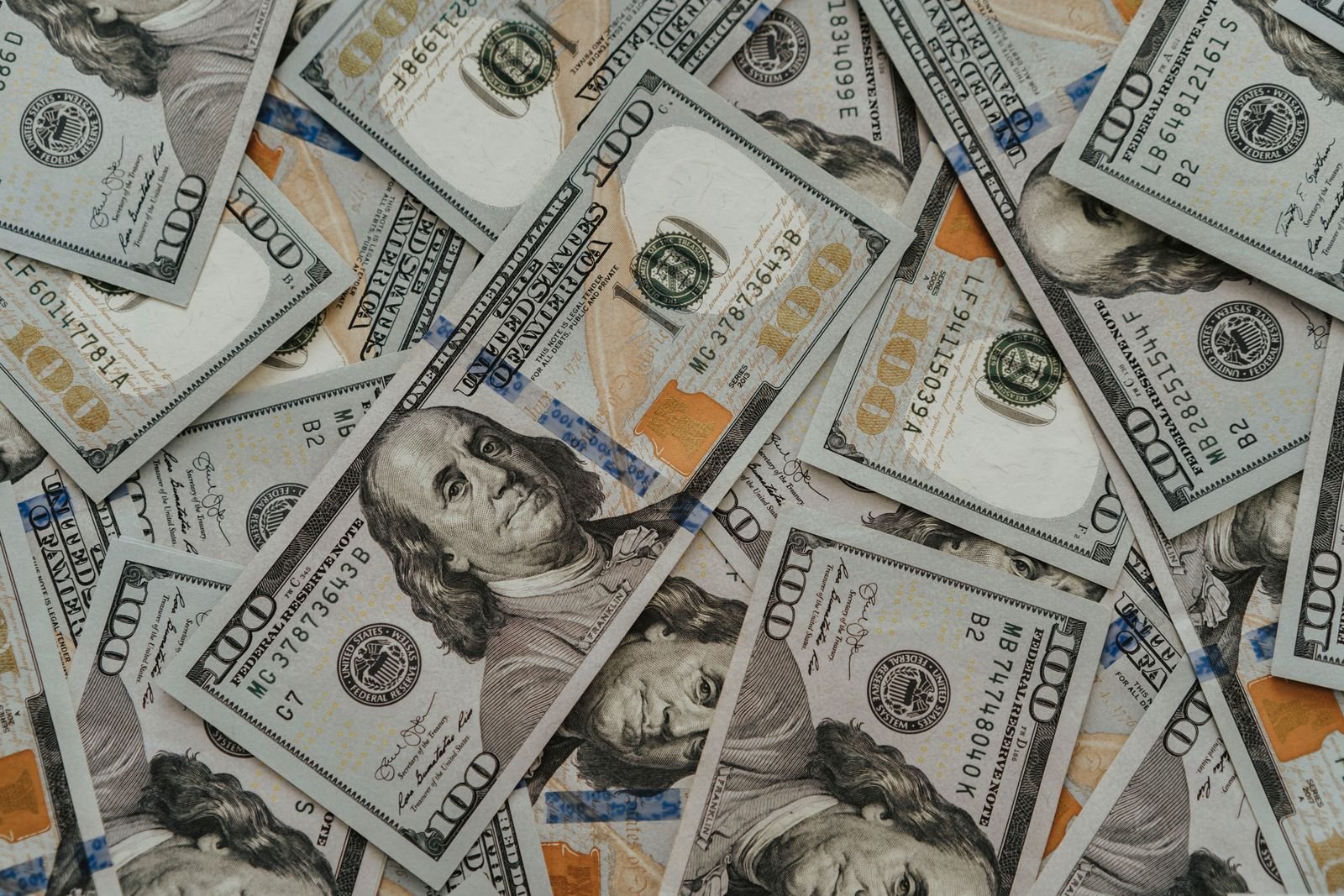 Close-up of US dollar bills, as dollar weakness helps fuel the current gold rally
