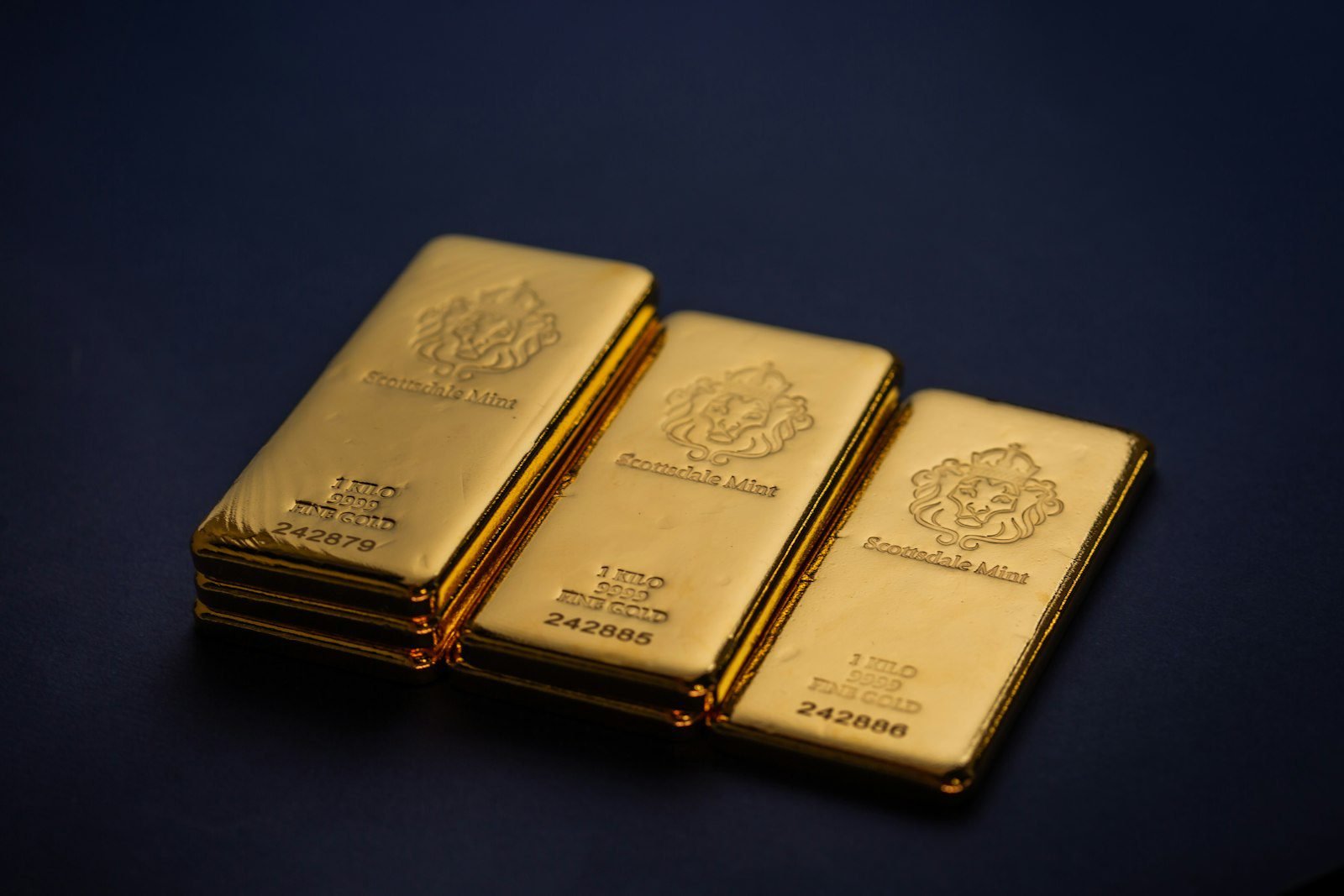 Stacked gold bars representing physical gold as a long-term investment