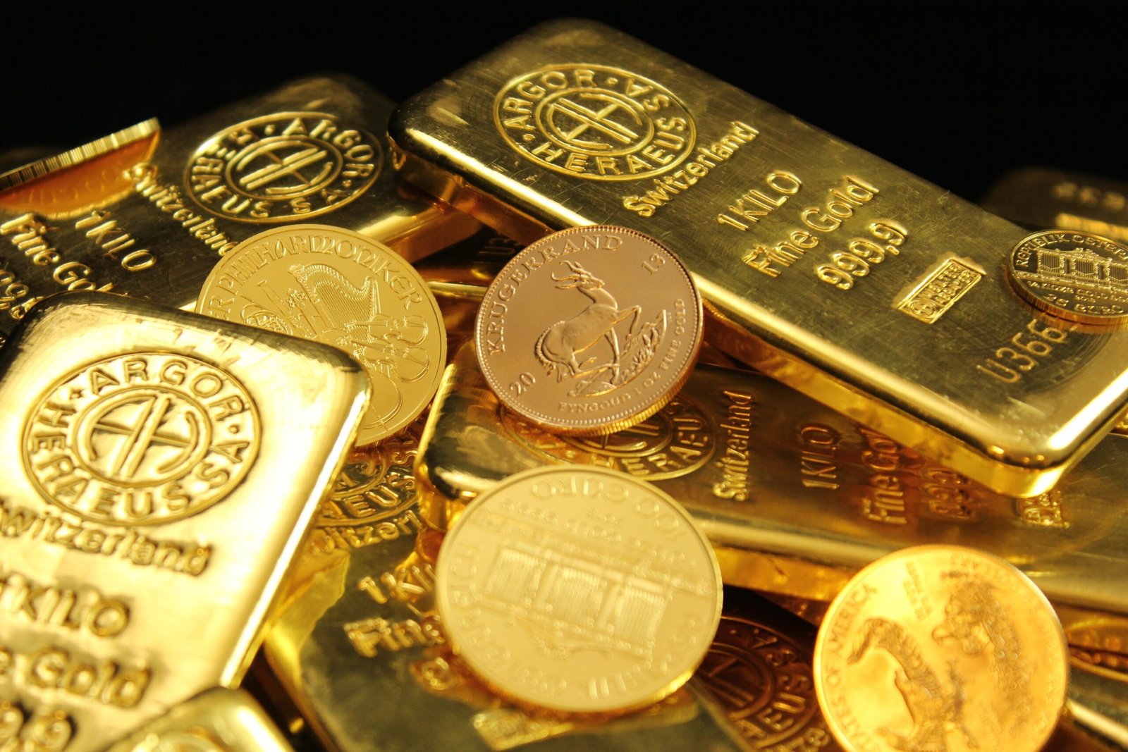 Gold and silver bullion coins arranged together representing precious metal investment