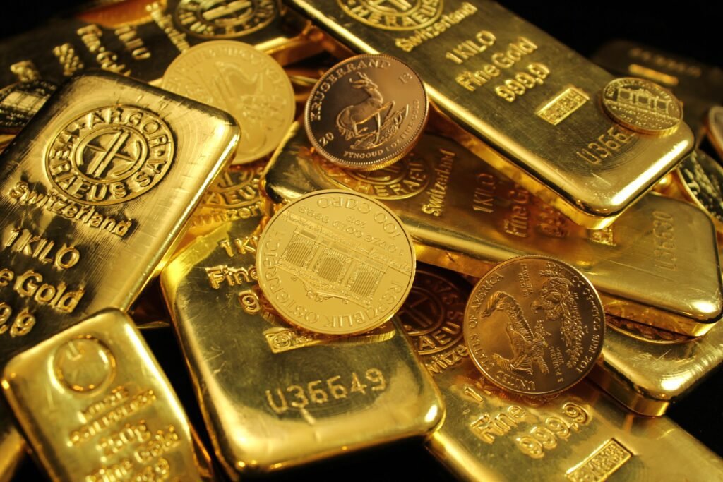Gold price record high Pakistan shown through close-up gold bars and coins
