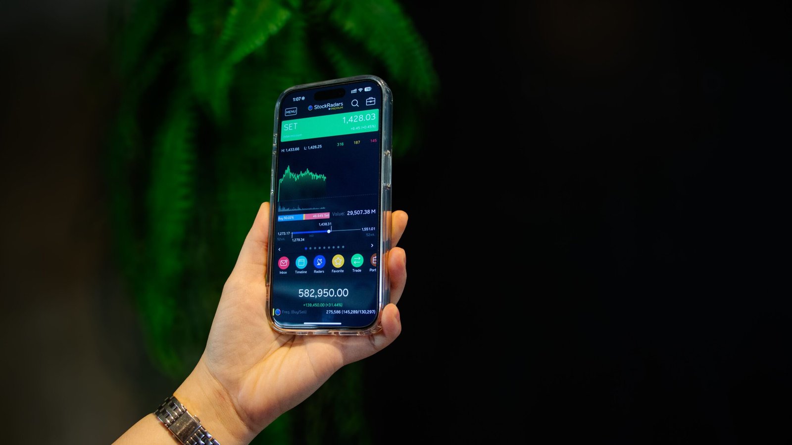 Close-up of a mobile stock and crypto trading app open on a smartphone screen
