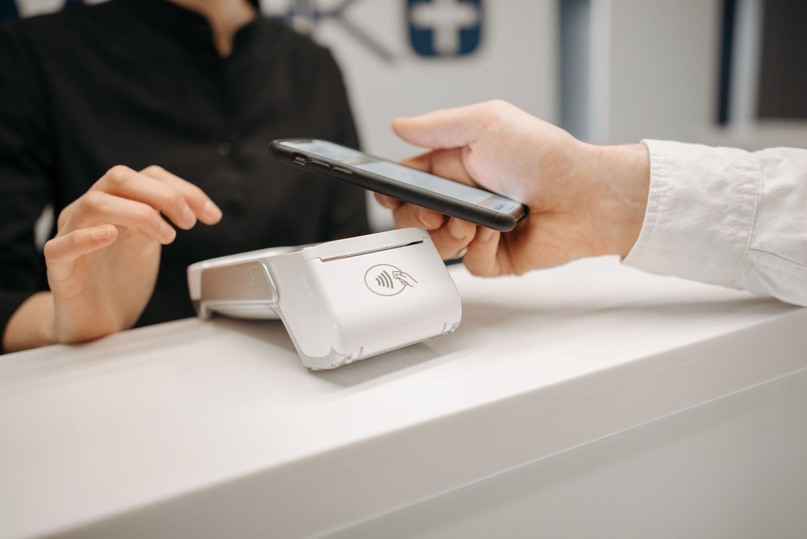 Person making a contactless mobile payment representing Pakistan's shift toward digital finance