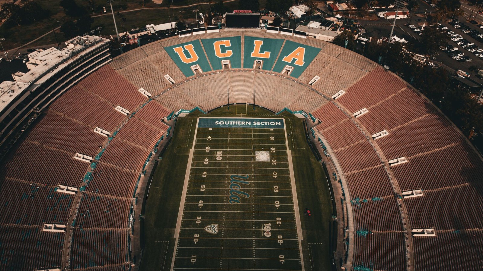 Aerial view of a large football stadium showing the scale behind modern franchise value