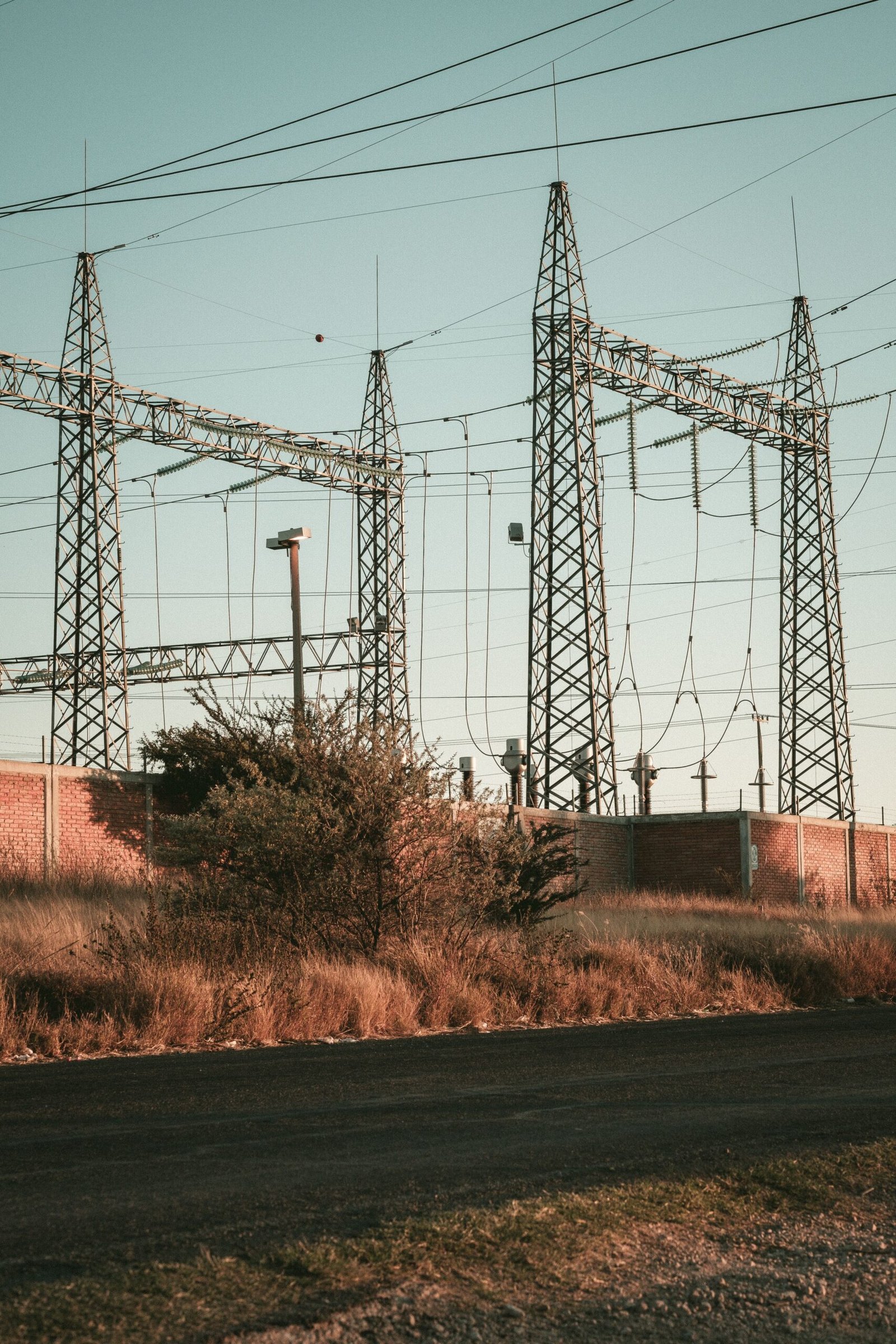 High voltage electrical substation in an open field, representing Disco power distribution infrastructure