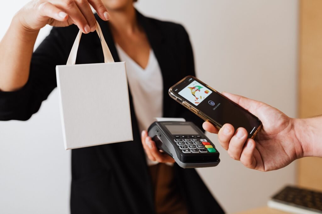 Person using a mobile payment app, illustrating Pakistan stablecoin remittance savings versus traditional bank transfers