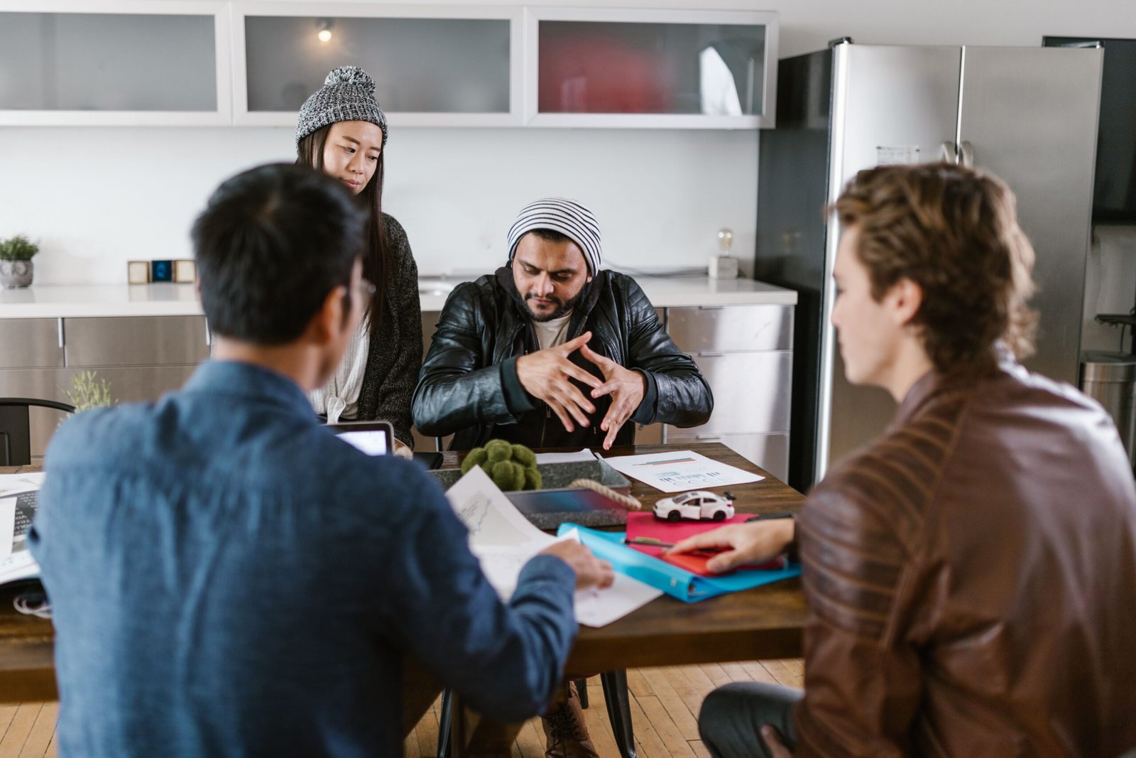 Pakistan Startup Fund Phase 2 concept shown through a startup team brainstorming a funding strategy in a modern office