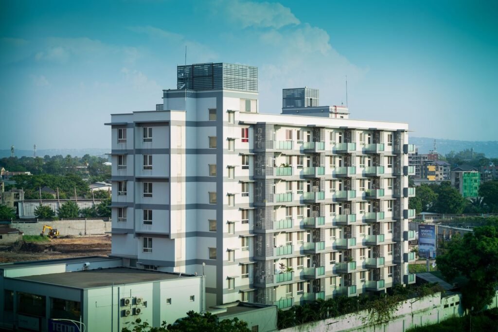 Real estate tokenization Pakistan concept shown through a modern high-rise residential building in an urban skyline