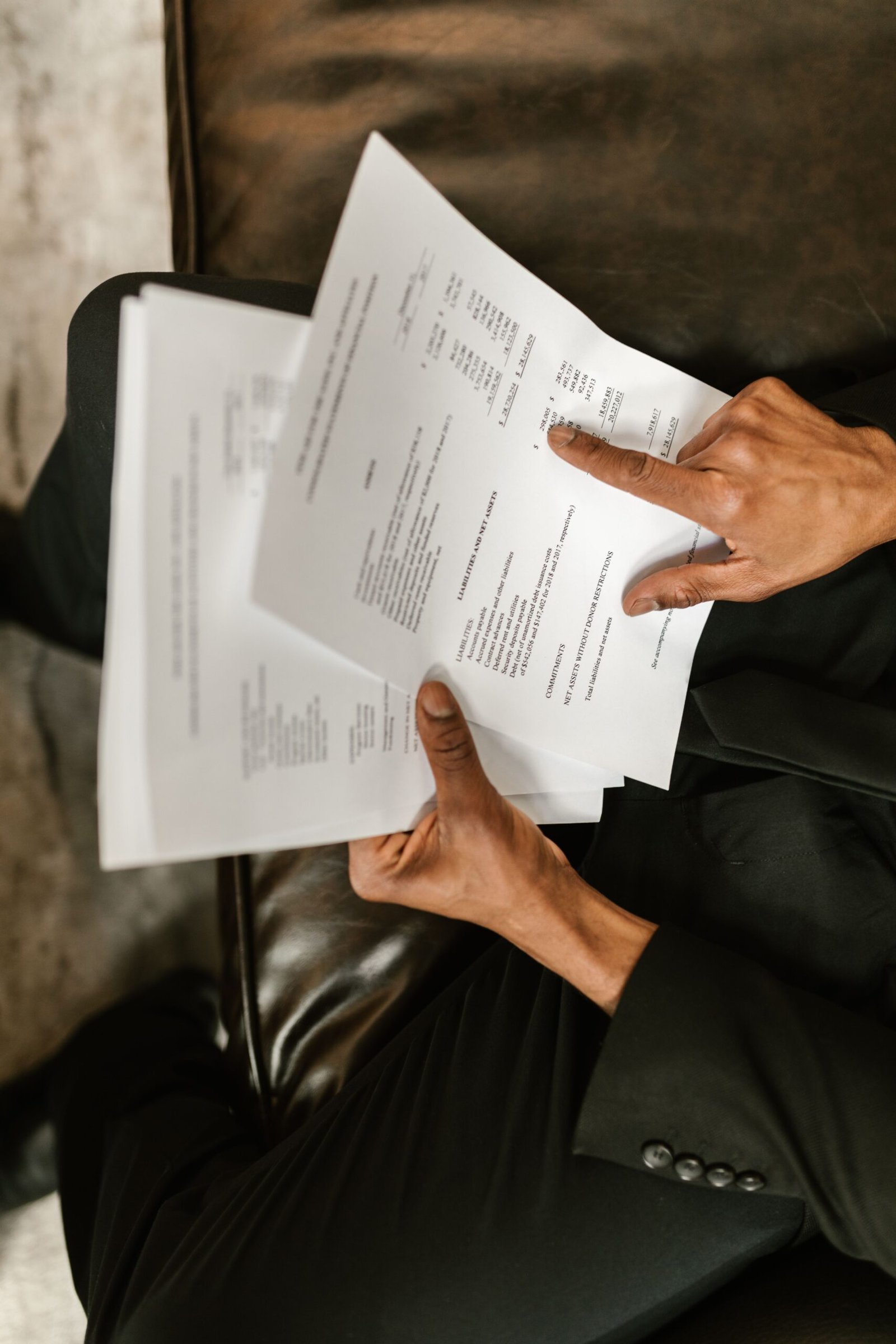 Financial professional reviewing reserve and economic data reports