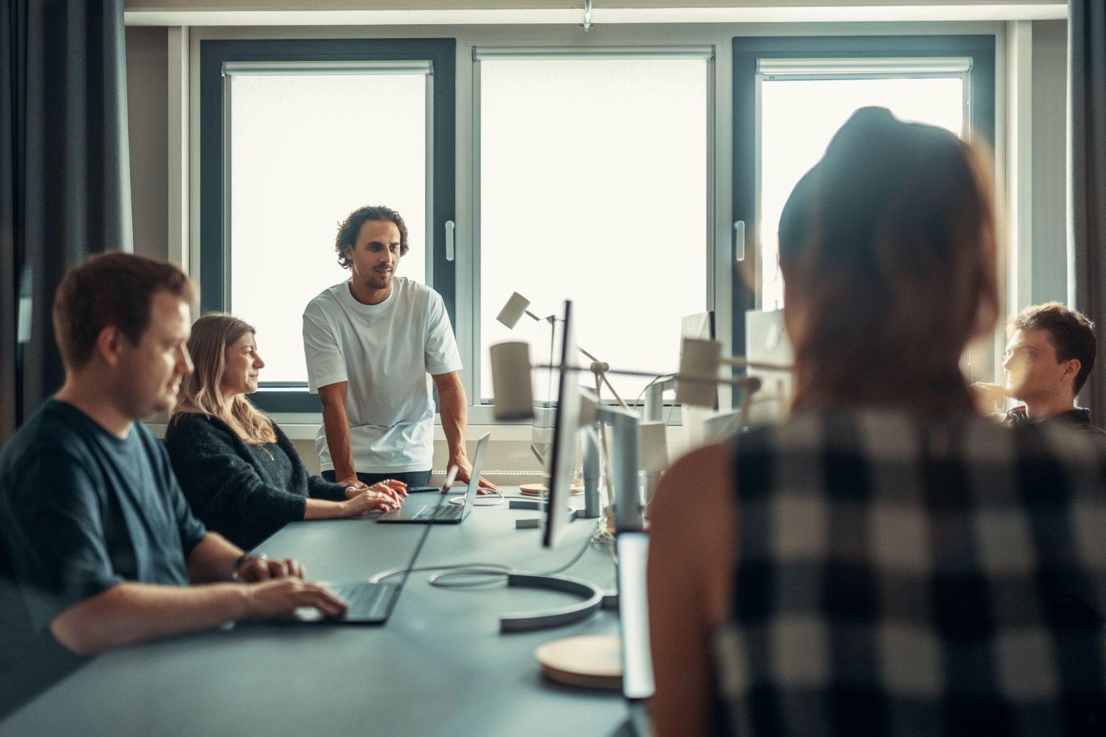 Team of fund managers in a modern office discussing venture capital licensing and fund governance