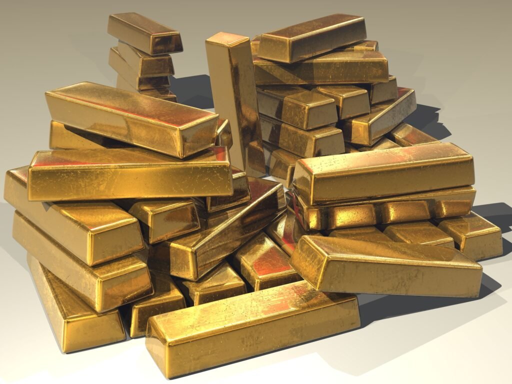 Gold bars representing gold price fall reason Pakistan investors are watching this week