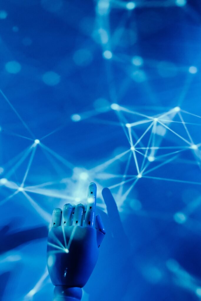 Robotic hand touching digital network representing Google Gemini security breach