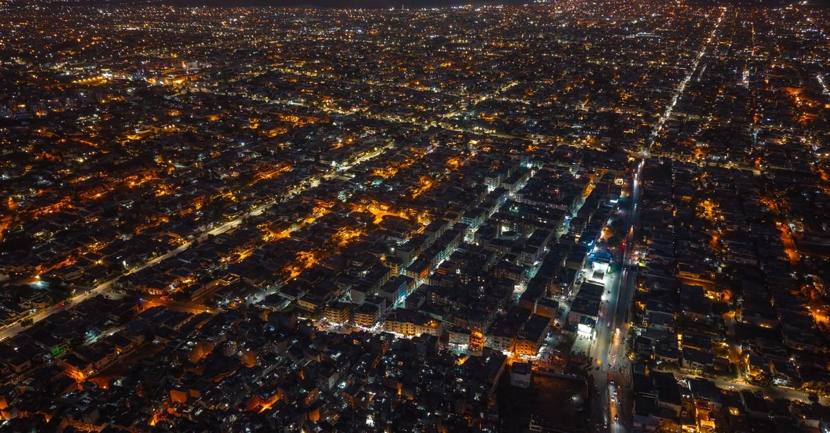 Karachi skyline at night representing the Naya Nazimabad REIT public subscription opening for investors