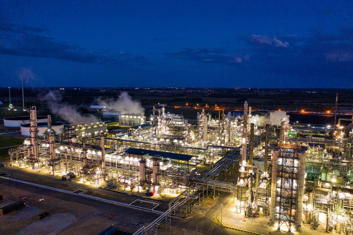 Aerial night view of an oil refinery, representing the $6 billion refinery upgrade deal in Pakistan