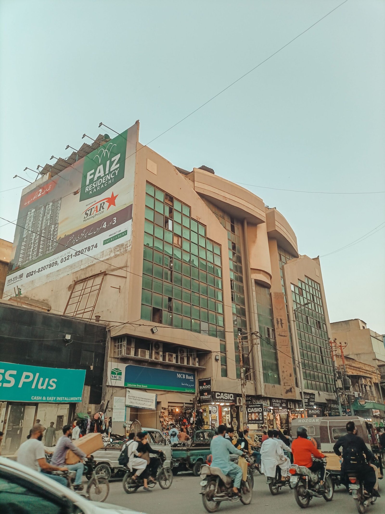 Busy urban street in Lahore near residential and commercial housing society areas