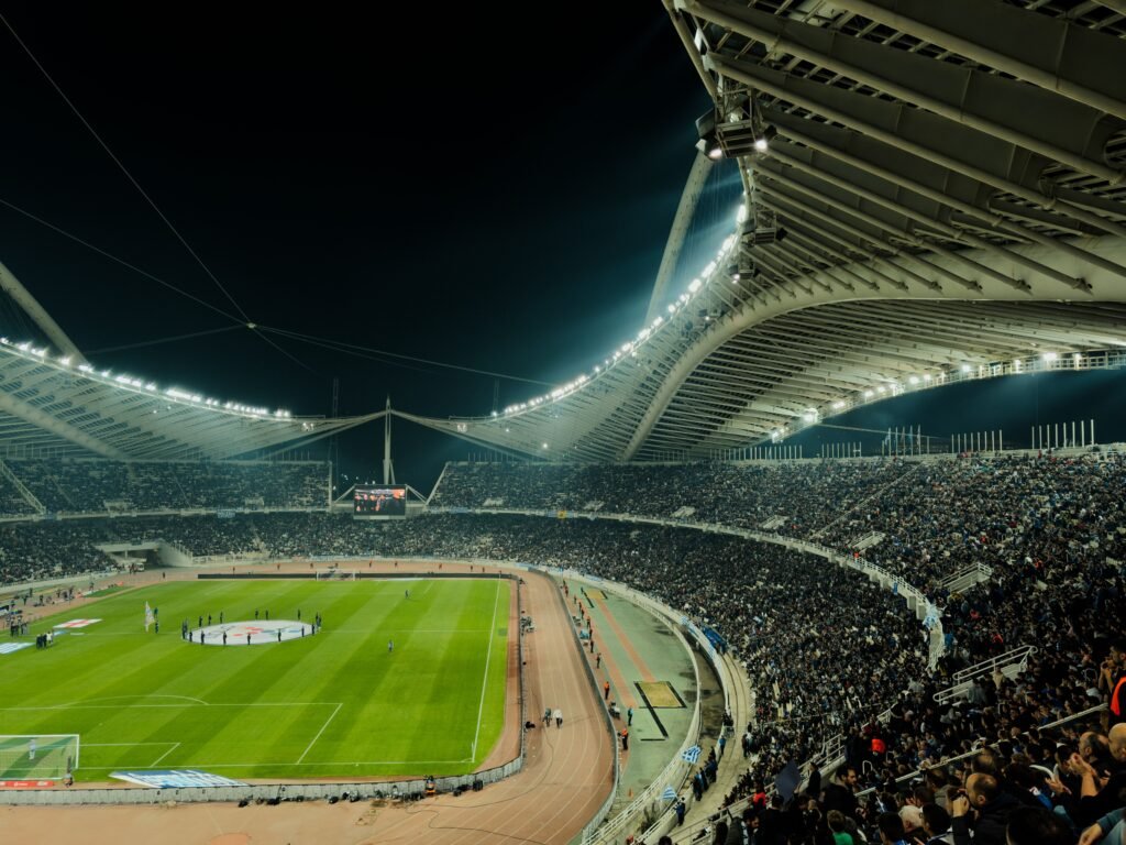 Floodlit football stadium packed with fans, symbolizing the Saudi Pro League privatization 2026 wave sweeping Al-Hilal and other clubs